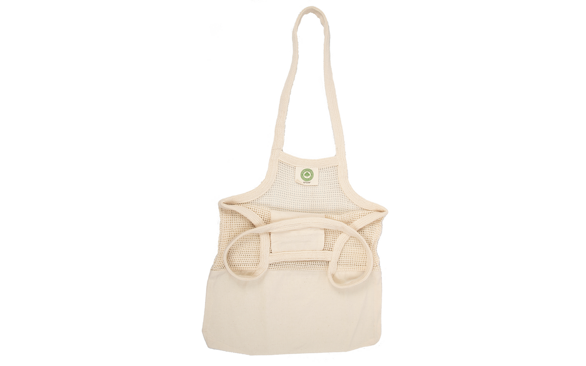 Empty cotton mesh tote with a solid fabric lower panel and long carrying handles.