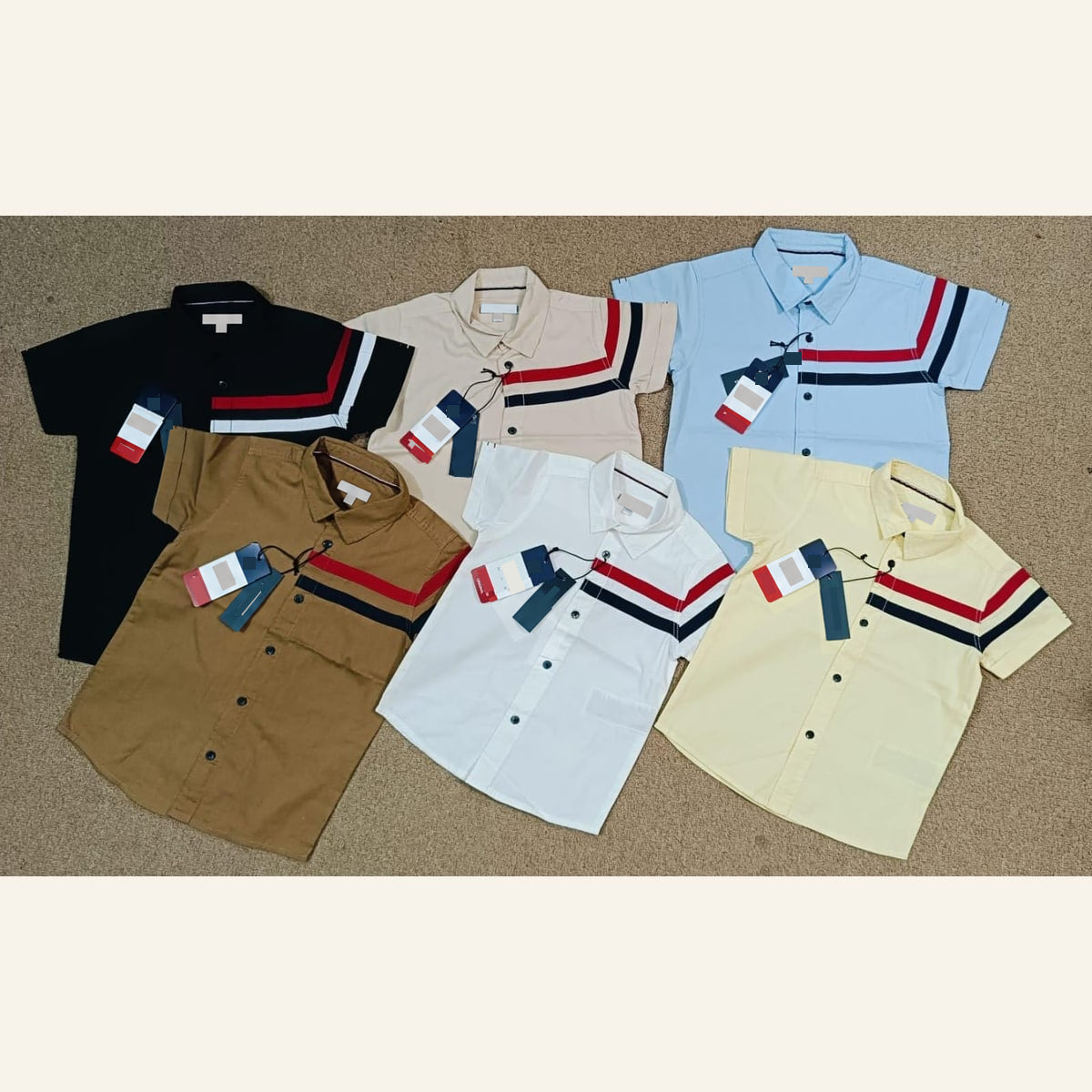 Boys’ short-sleeve collared shirt colorway preview with striped chest detail; interest signup only. Garments shown do not indicate a bundle.