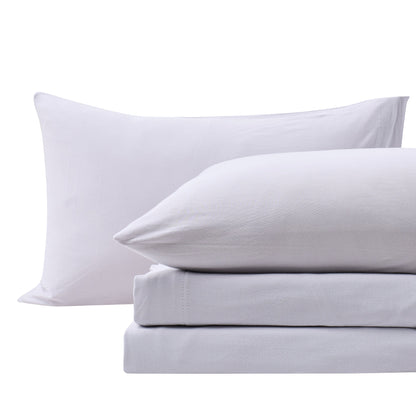 Close-up of Fog Grey cotton jersey-knit pillowcases and matching sheet fabric.