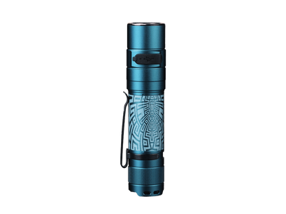 Graffiti-finish Fenix E35R flashlight shown upright with its patterned body.