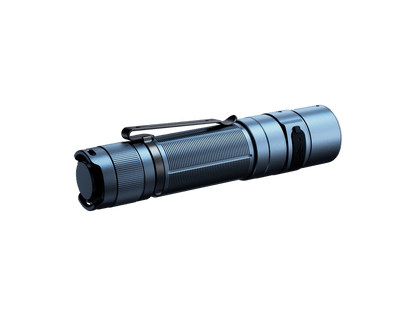 Glacier Blue Fenix E35R flashlight shown at an angle on a green background.
