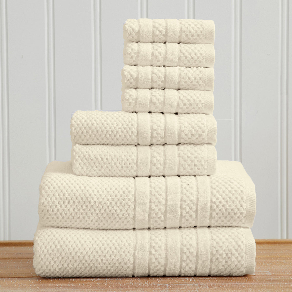 Ivory Giuliana Collection checkered jacquard towel set folded in a stack.