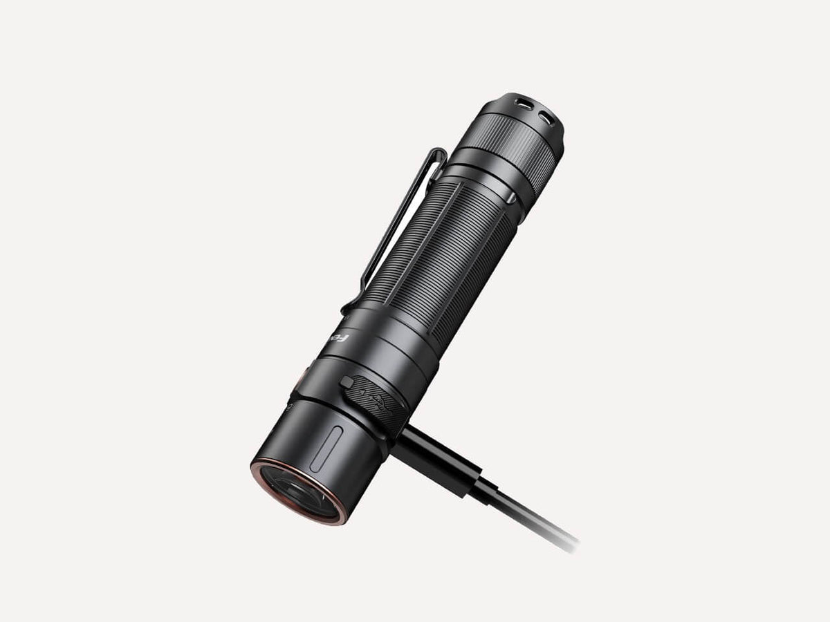 Black Fenix E35R flashlight with its lanyard attached, shown at an angle.