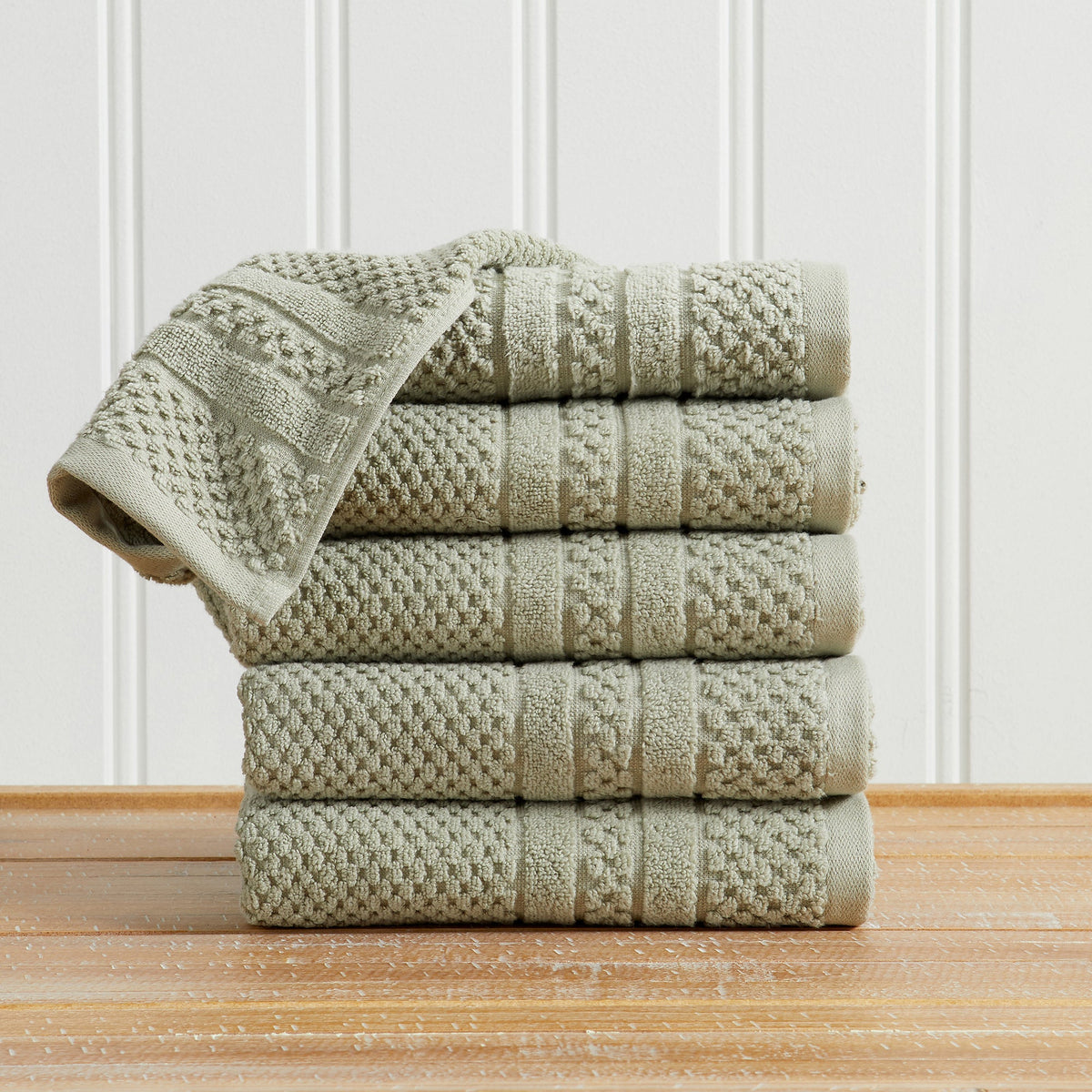 Eucalyptus Giuliana Collection checkered jacquard hand towels folded and stacked.