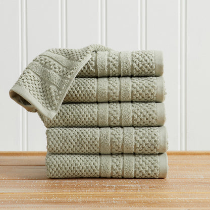 Eucalyptus Giuliana Collection checkered jacquard hand towels folded and stacked.