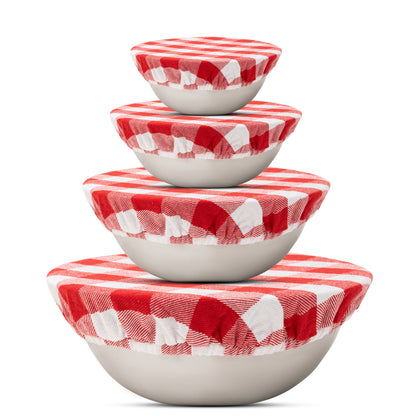 Four red and white checked cloth covers on graduated bowls