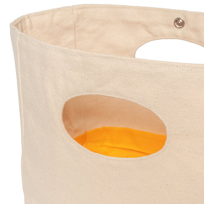 Canvas basket cutout handle and snap detail