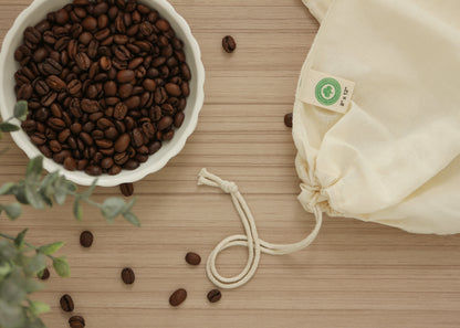 Cotton filter bag beside coffee beans; ingredients not included