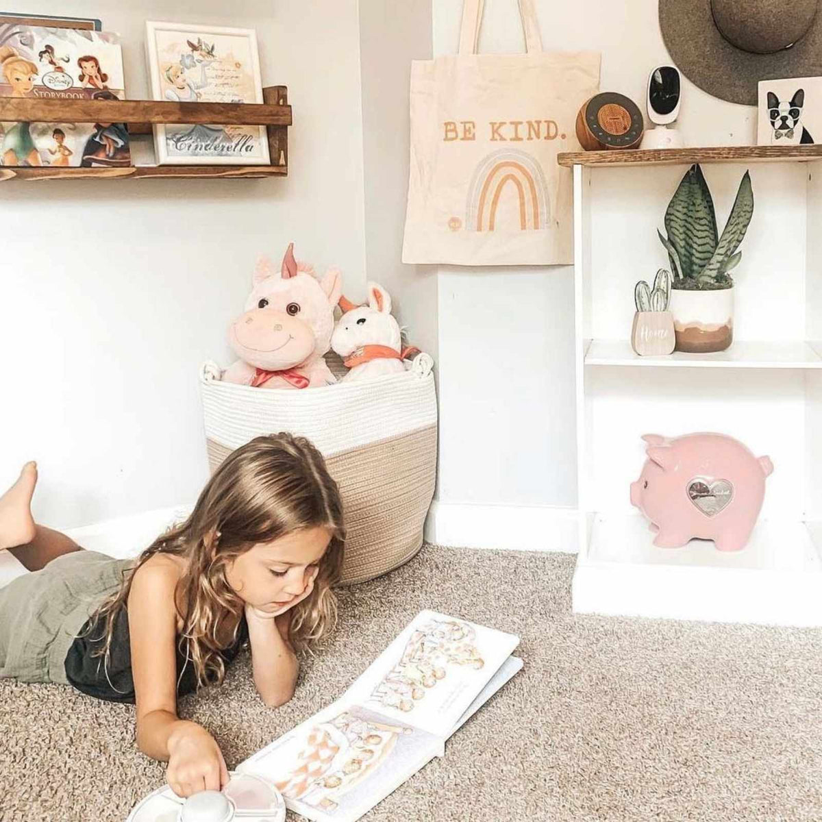 Rope basket with stuffed toys in a child's reading corner; toys and room furnishings are not included.