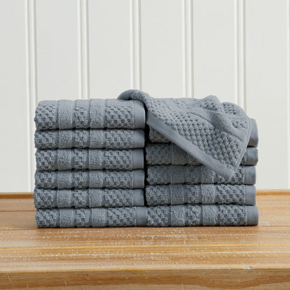 Blue Giuliana Collection checkered jacquard washcloths folded and stacked.